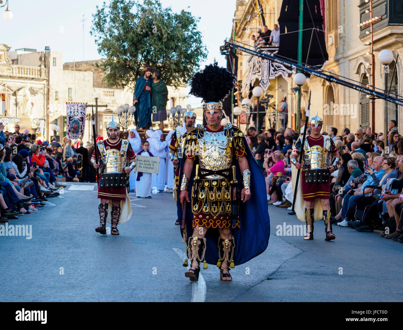 Inhabitants of Zejtun / Malta had their traditional Good Friday procession in front of their church, some of them dressed like Roman legionaries Stock Photo