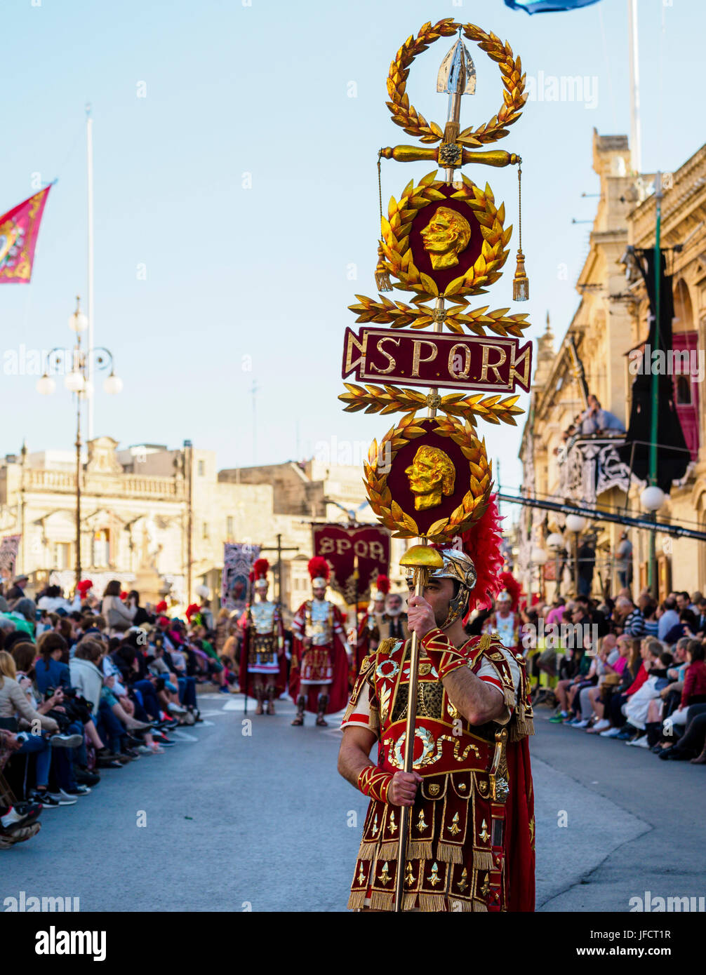 Inhabitants of Zejtun / Malta had their traditional Good Friday procession, some of them dressed like Roman legionaries with SPQR / S.P.Q.R. sign Stock Photo