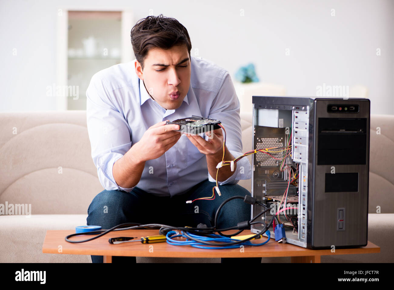 Frustrated man with broken pc computer Stock Photo - Alamy