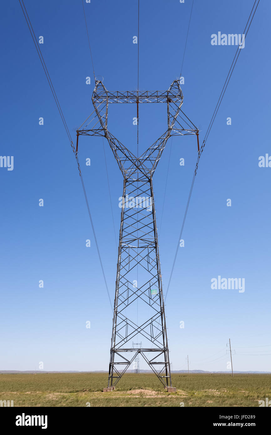 electricity transmission pylon in prairie Stock Photo