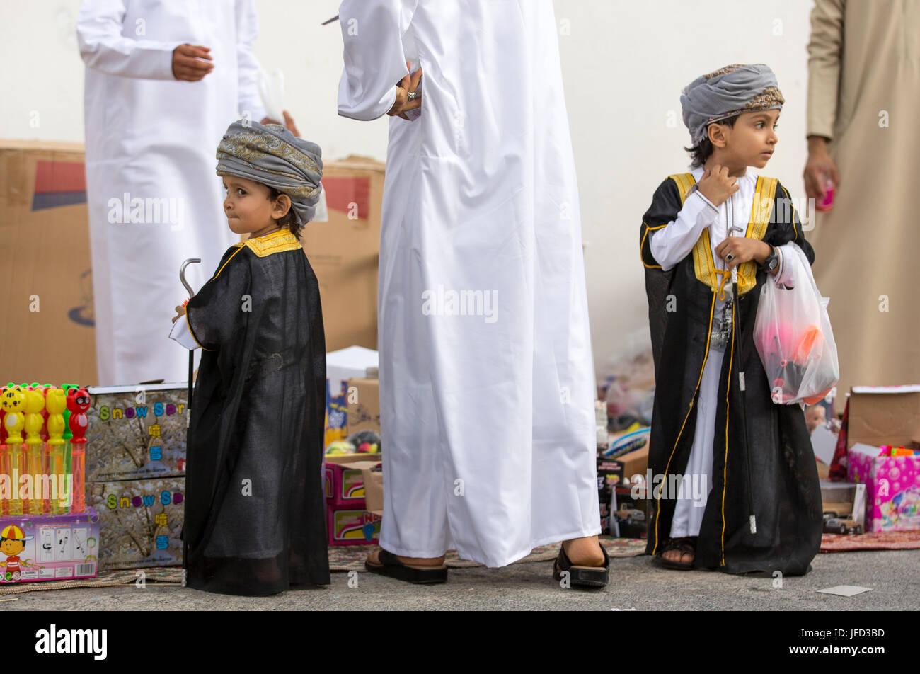 Nizwa, Oman - June 26th 2017: people at a toy market on a day of Eid al Fitr, celebration at the end of Holy Month of Ramadan Stock Photo