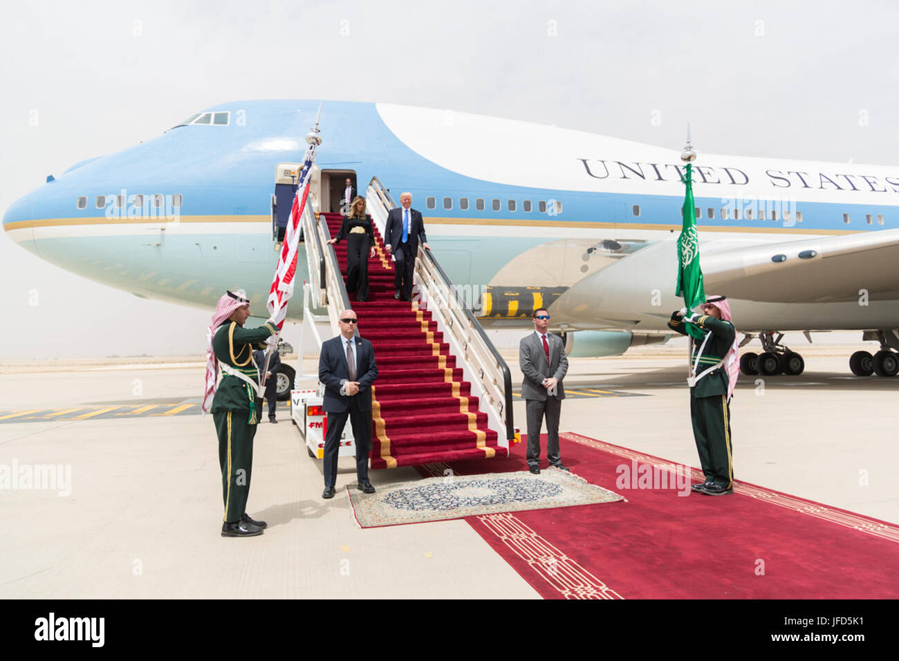President Donald Trump and First Lady Melania Trump walk down red-carpeted stairs, Saturday, May 20, 2017, on their arrival to King Khalid International Airport in Riyadh, Saudi Arabia. (Official White House Photo by Shealah Craighead) Stock Photo