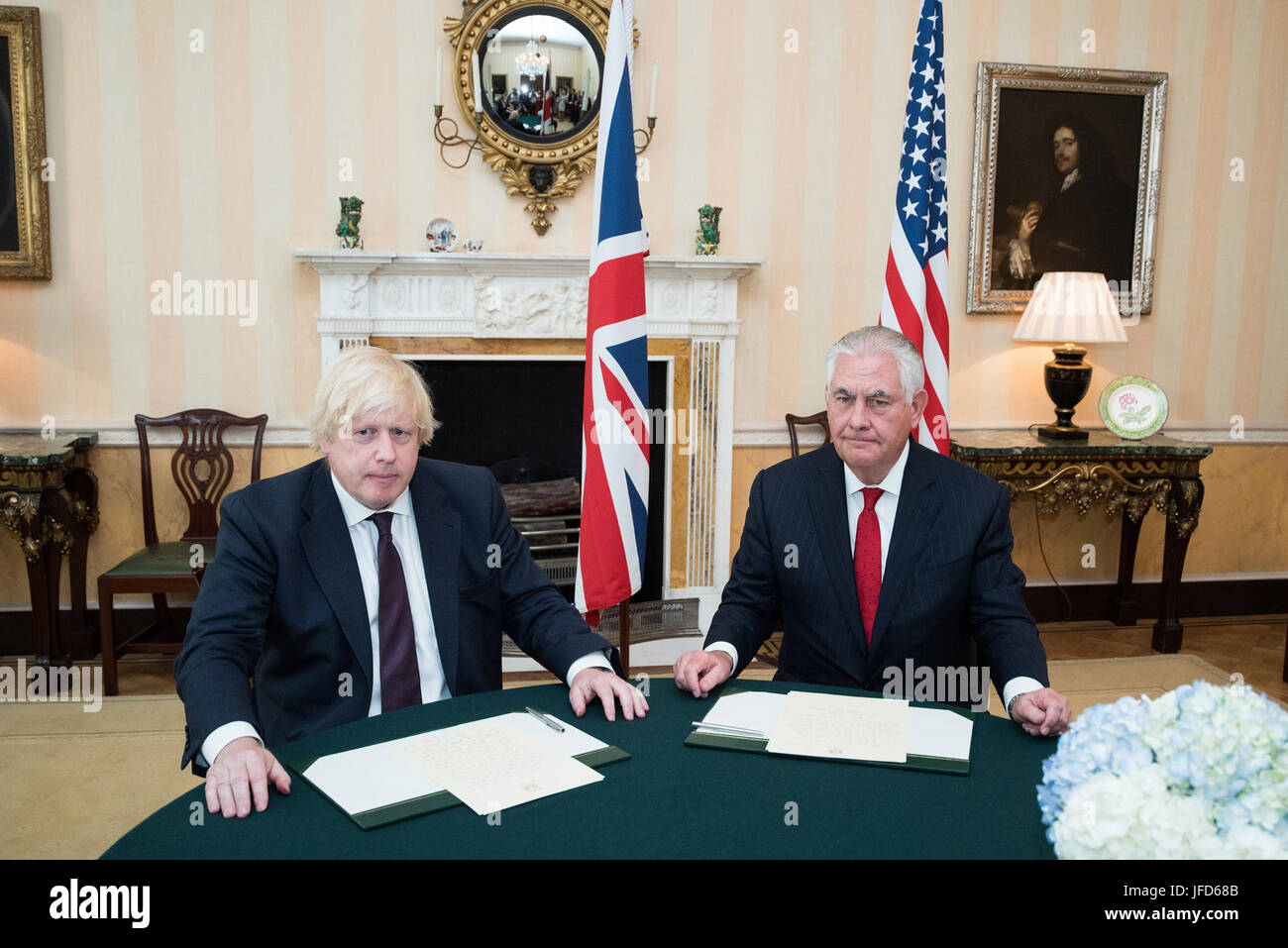 U.S. Secretary of State Rex Tillerson and U.K. Foreign Secretary Boris Johnson before signing a condolence book for the victims of the terrorist attack in Manchester, at Carlton House in London, United Kingdom, on May 26, 2017. Stock Photo