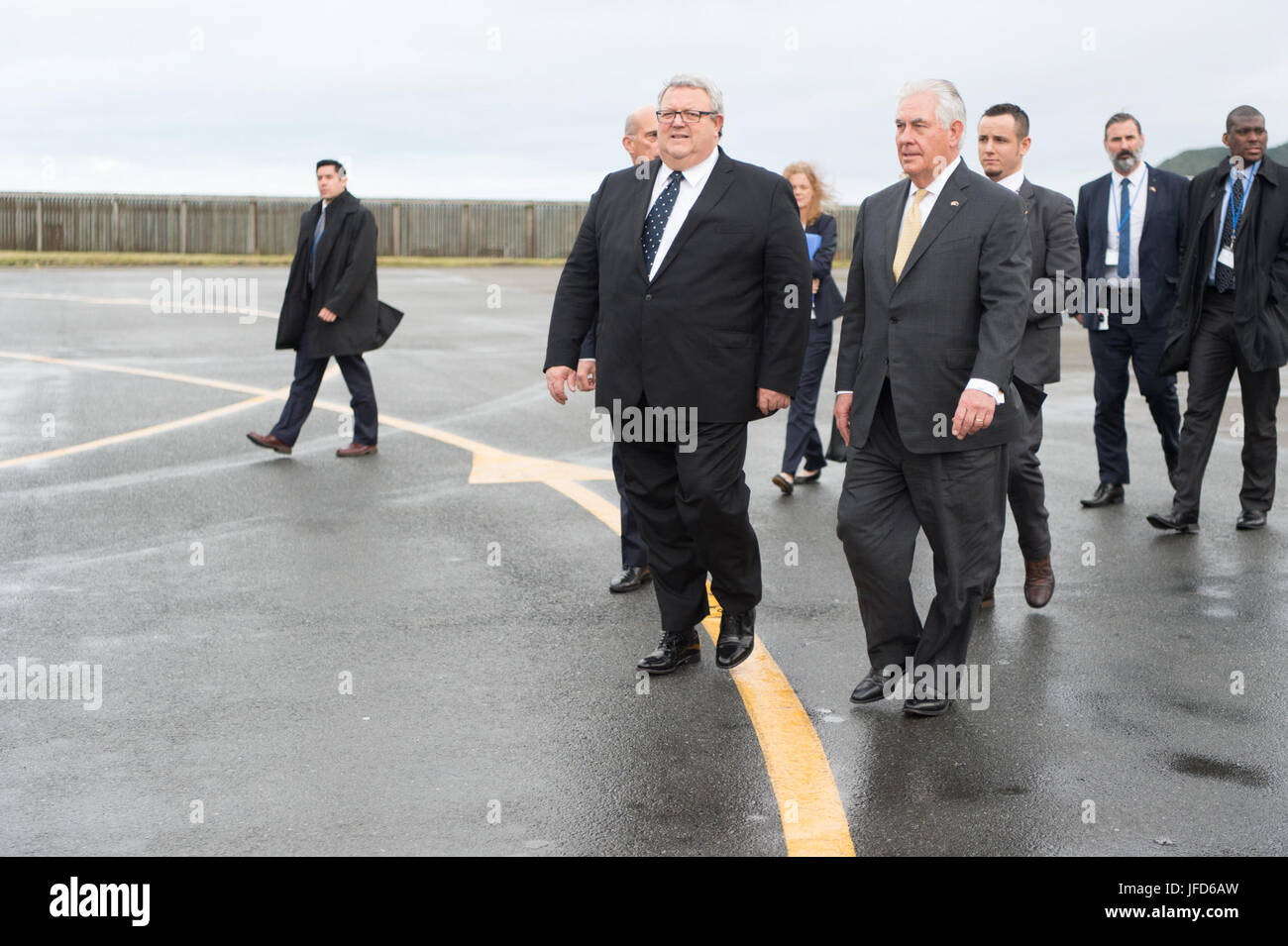 U.S. Secretary of State Rex Tillerson is escorted to his plane by New Zealander Foreign Minister Gerry Brownlee in Wellington, New Zealand, on June 6, 2017. Stock Photo