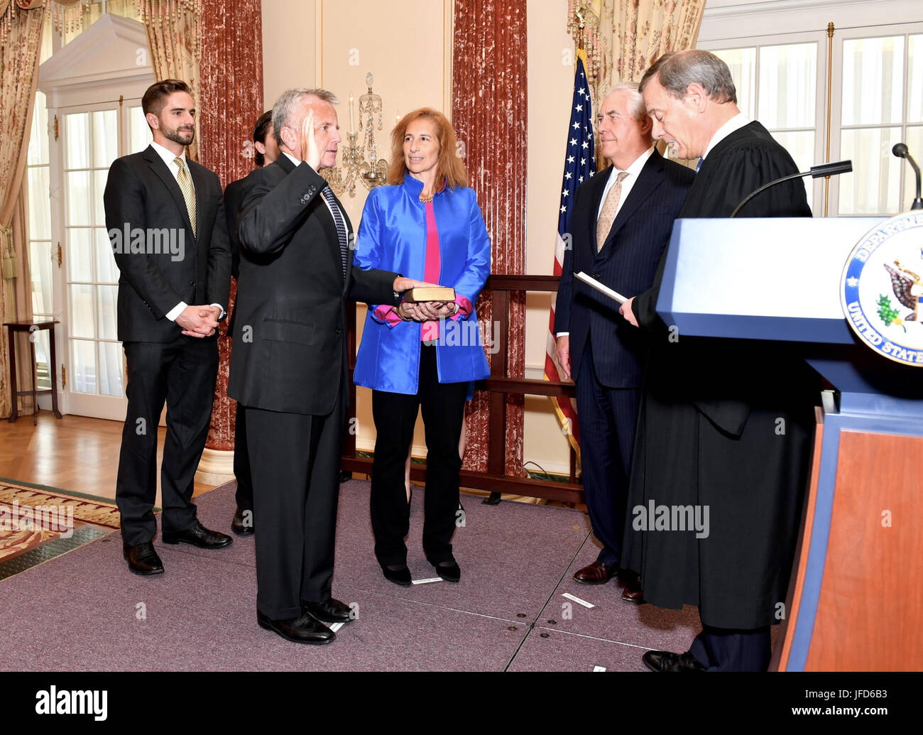 With family and U.S. Secretary of State Rex Tillerson looking on, U.S. Chief Justice John G. Roberts Jr. swears in John Sullivan as the new Deputy Secretary of State at a ceremony at the U.S. Department of State in Washington, D.C., on June 9, 2017. Stock Photo