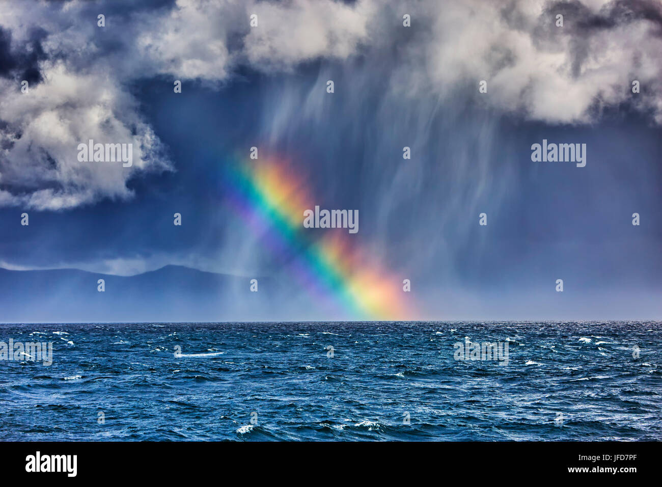 Rainbow over sea, Seltjarnarnes, Seltjarnarnesi, Island Stock Photo