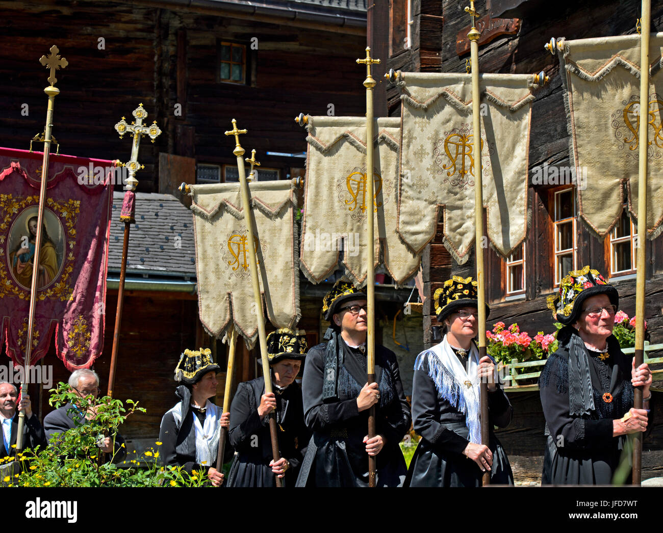 Woman In Traditional Costumes With Church Banners Flags Corpus