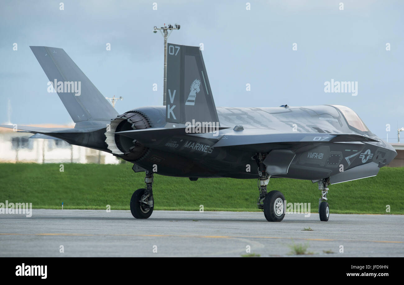 U.S. Marine Corps F-35B Lightning II aircraft makes its way off the flight line after a hot pit refuel on Kadena Air Force Base, Okinawa, Japan, June 27, 2017. The Marines are with Marine Fighter Attack Squadron 121, Marine Aircraft Group 36, 1st Marine Aircraft Wing, III Marine Expeditionary Force. The two-day exercise enabled the U.S. Air Force and Marine Corps to improve interoperability and develop tactics, techniques and procedures involving the new aircraft for future joint FARP operations throughout the Indo-Asia Pacific Theater. (U.S. Marine Corps photo by Lance Cpl. Deseree Kamm) Stock Photo