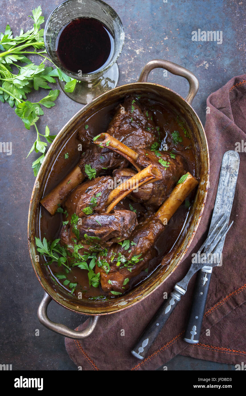 Slow Cooked Lamb Shanks in Red Wine Sauce Stock Photo - Alamy