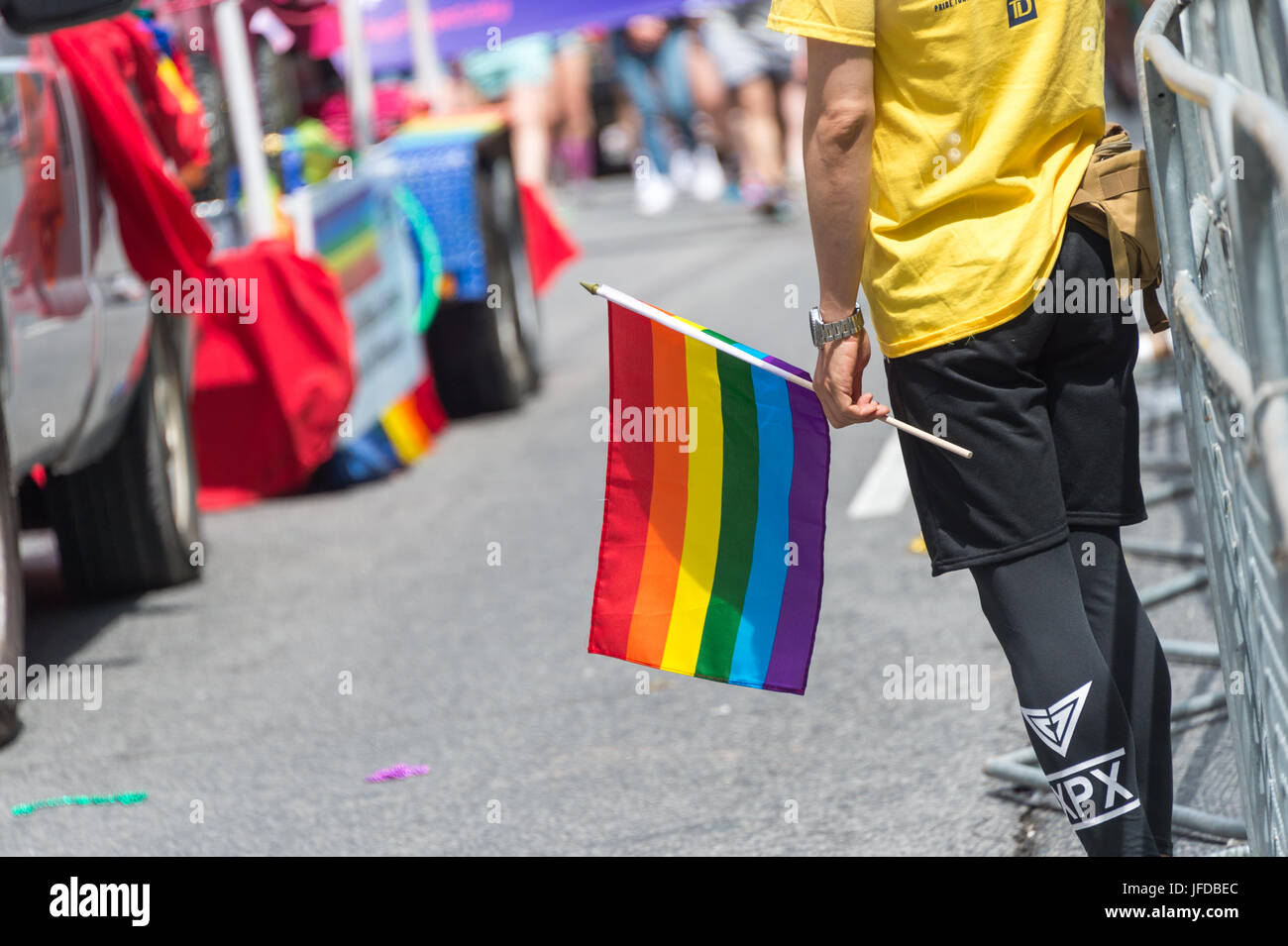 GayPride spectator holding rainbow gay flag during Toronto Pride Parade. Toronto, Canada - 25 June 2017) Stock Photo