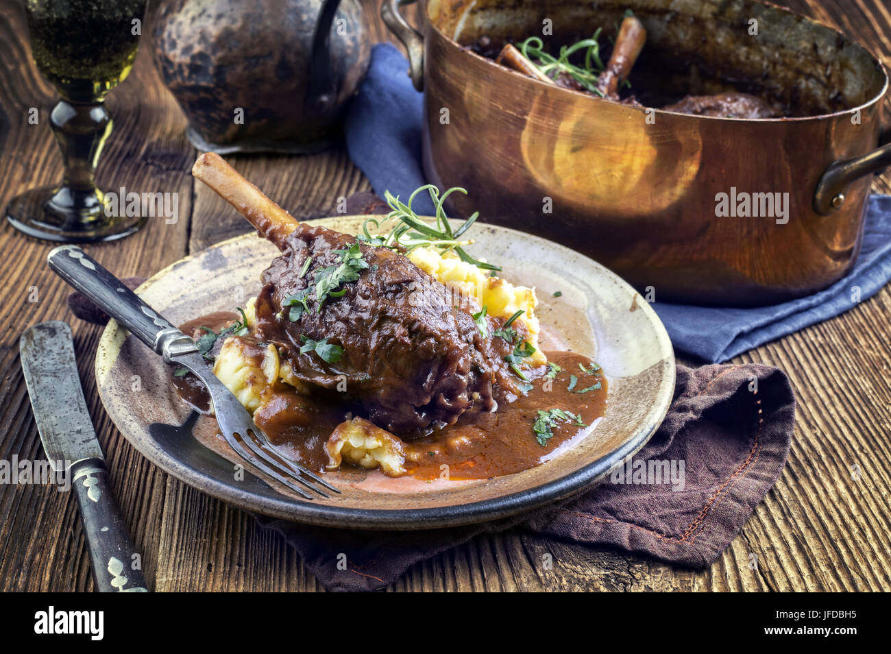 Slow Cooked Lamb Shanks in Red Wine Sauce Stock Photo Alamy