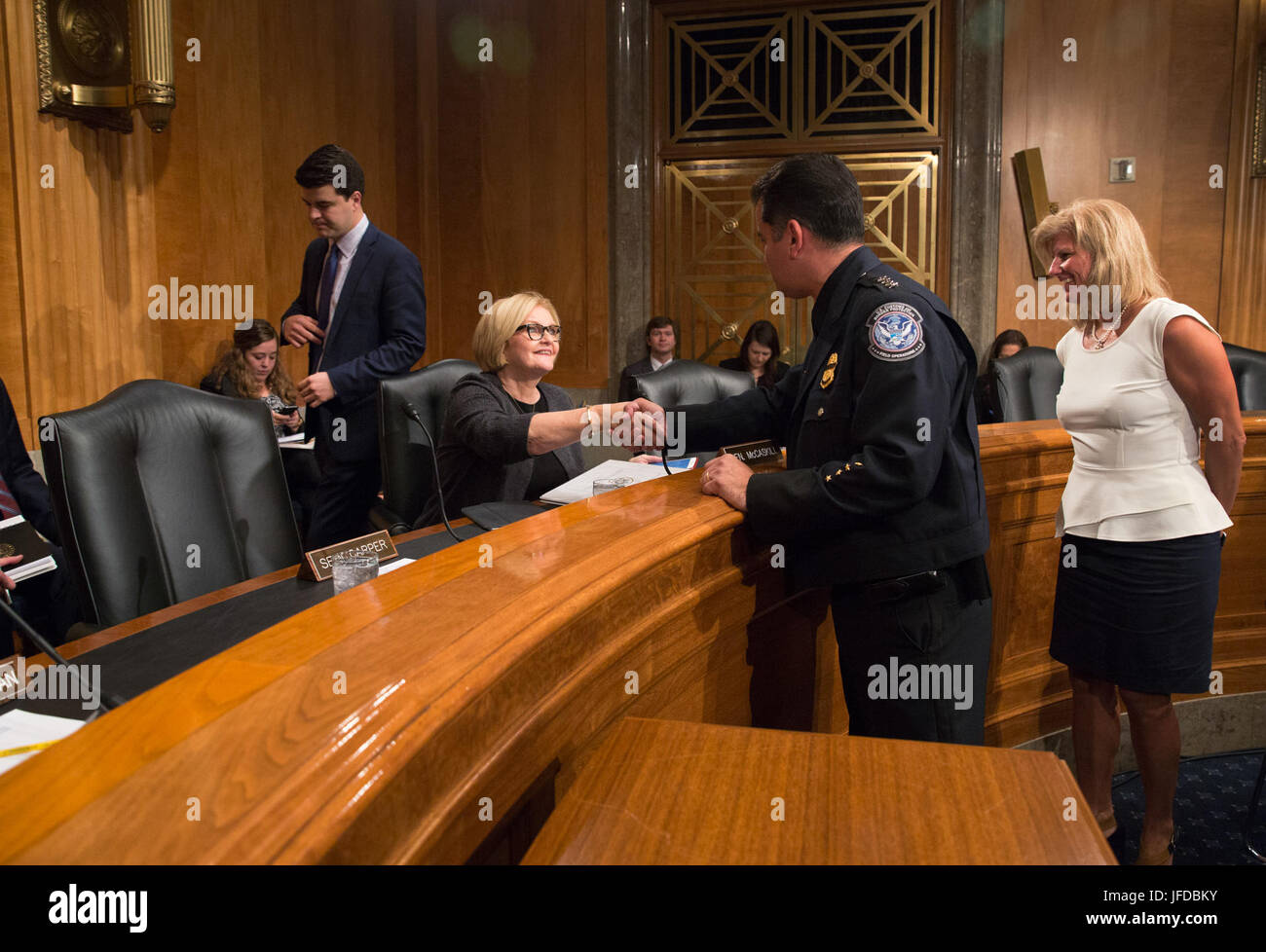 U.S. Customs and Border Protection Acting Executive Assistant Commissioner for Operations Support Robert Perez introduces himself to Sen. Claire Conner McCaskill prior to testifying before the Senate Governmental Affairs Committee during a subcommittee hearing on U.S. strategy to combat illicit drugs in the Permanent Subcommittee on Investigations titledÔ 'Stopping the Shipment of Synthetic Opioids: Oversight of U.S. Strategy to Combat Illicit Drugs' in Washington, D.C., May 25, 2017. U.S. Customs and Border Protection Stock Photo