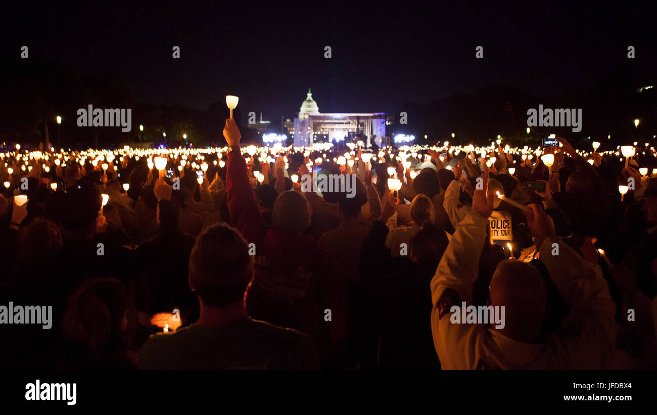 Law enforcement officers gather at the National Mall for a candlelight ...