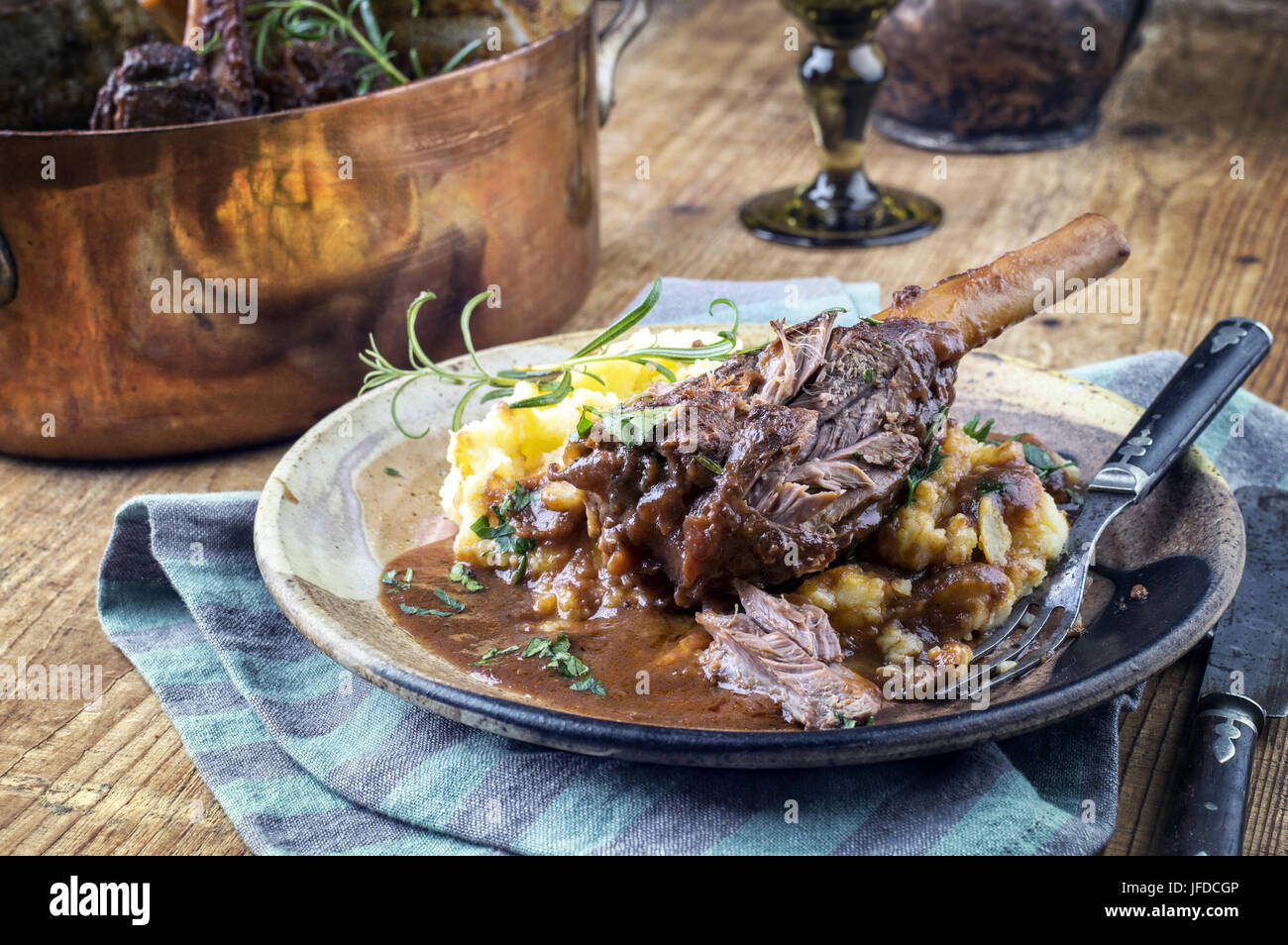 Slow Cooked Lamb Shanks in Red Wine Sauce Stock Photo - Alamy