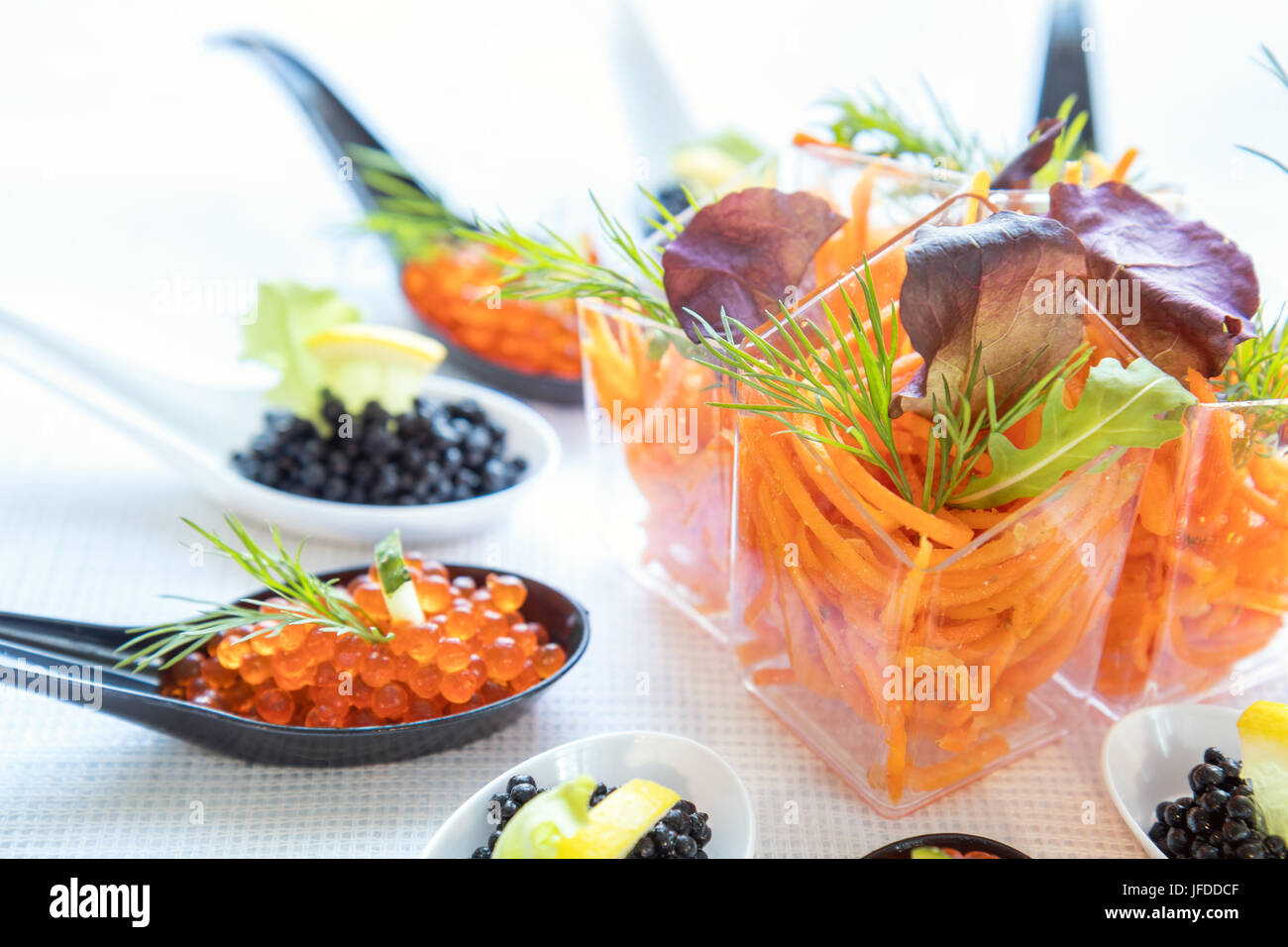 Catering banquet table with salad and caviar Stock Photo