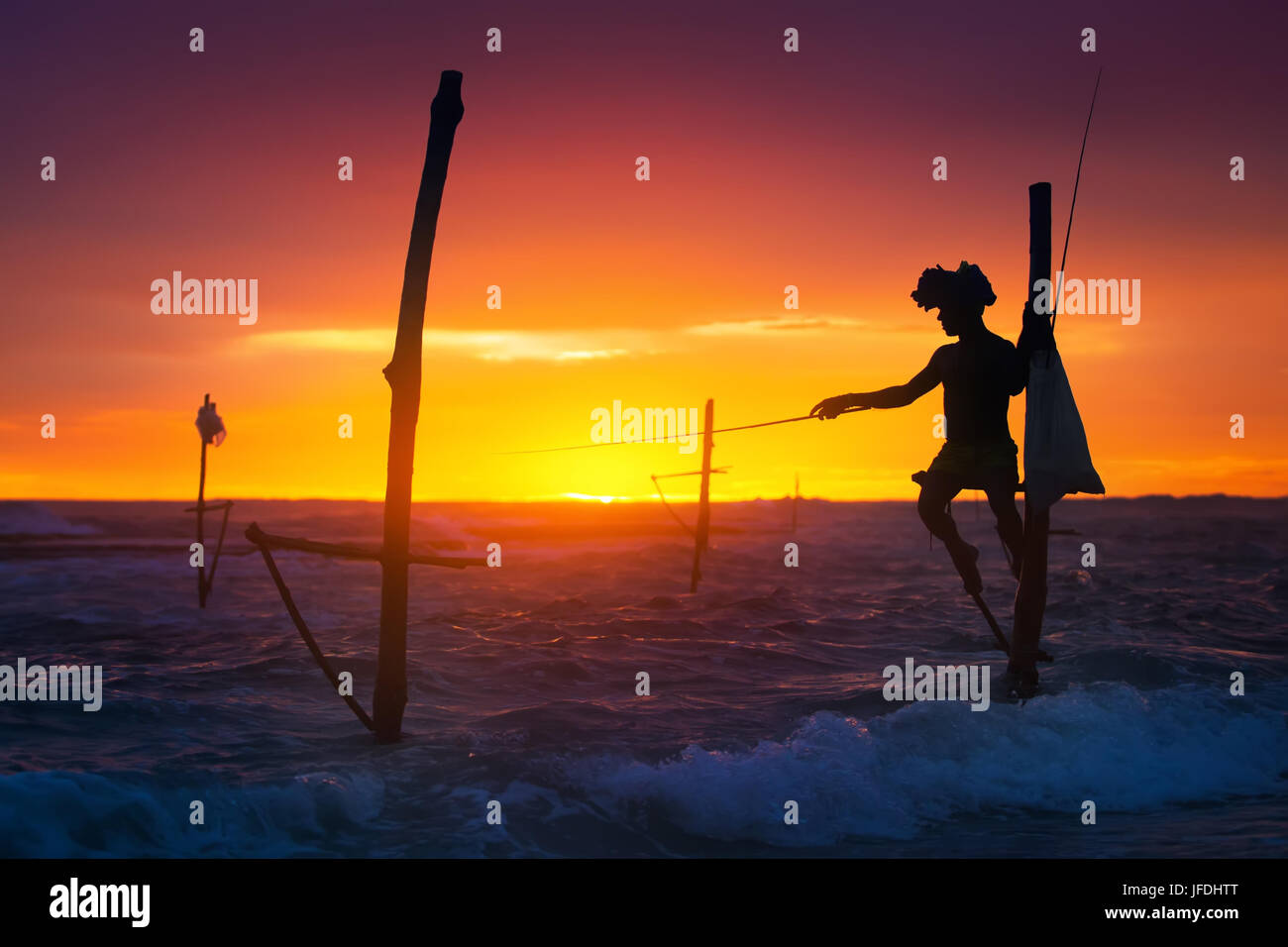 Sri Lanka's Stilt Fisherman. Fishing on stilt is very common in many Asian countries, but most of all - in Sri Lanka, in the Ahangama village. Stock Photo