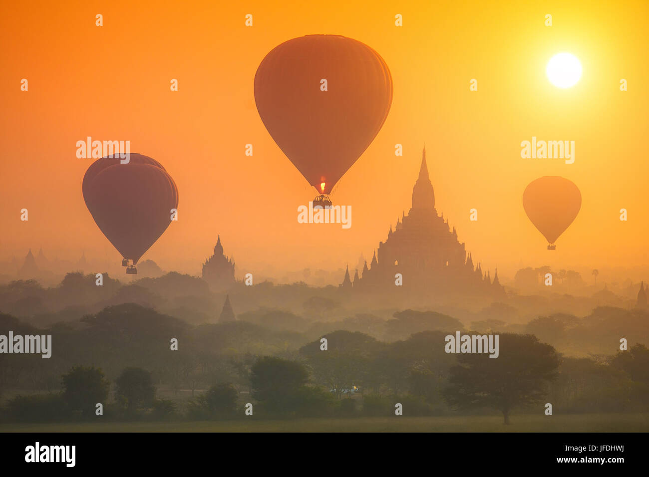 Hot air balloons over the ancient pagodas of the Old Bagan (Myanmar). Stock Photo