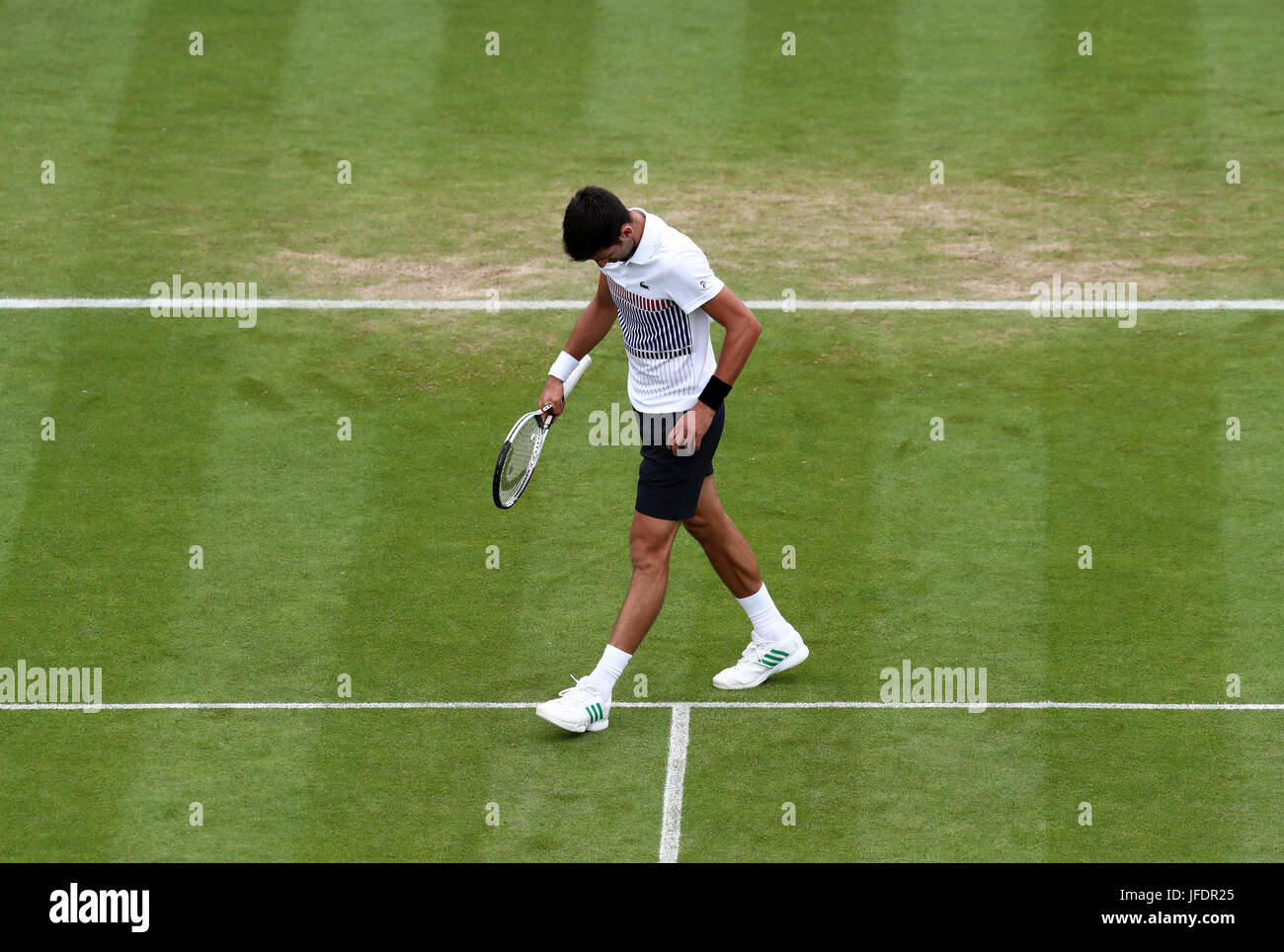 Serbia's Novak Djokovic appears dejected during his match against Russia's Daniil Medvedev during day eight of the AEGON International at Devonshire Park, Eastbourne. PRESS ASSOCIATION Photo. Picture date: Friday June 30, 2017. See PA story TENNIS Eastbourne. Photo credit should read: Gareth Fuller/PA Wire. . Stock Photo