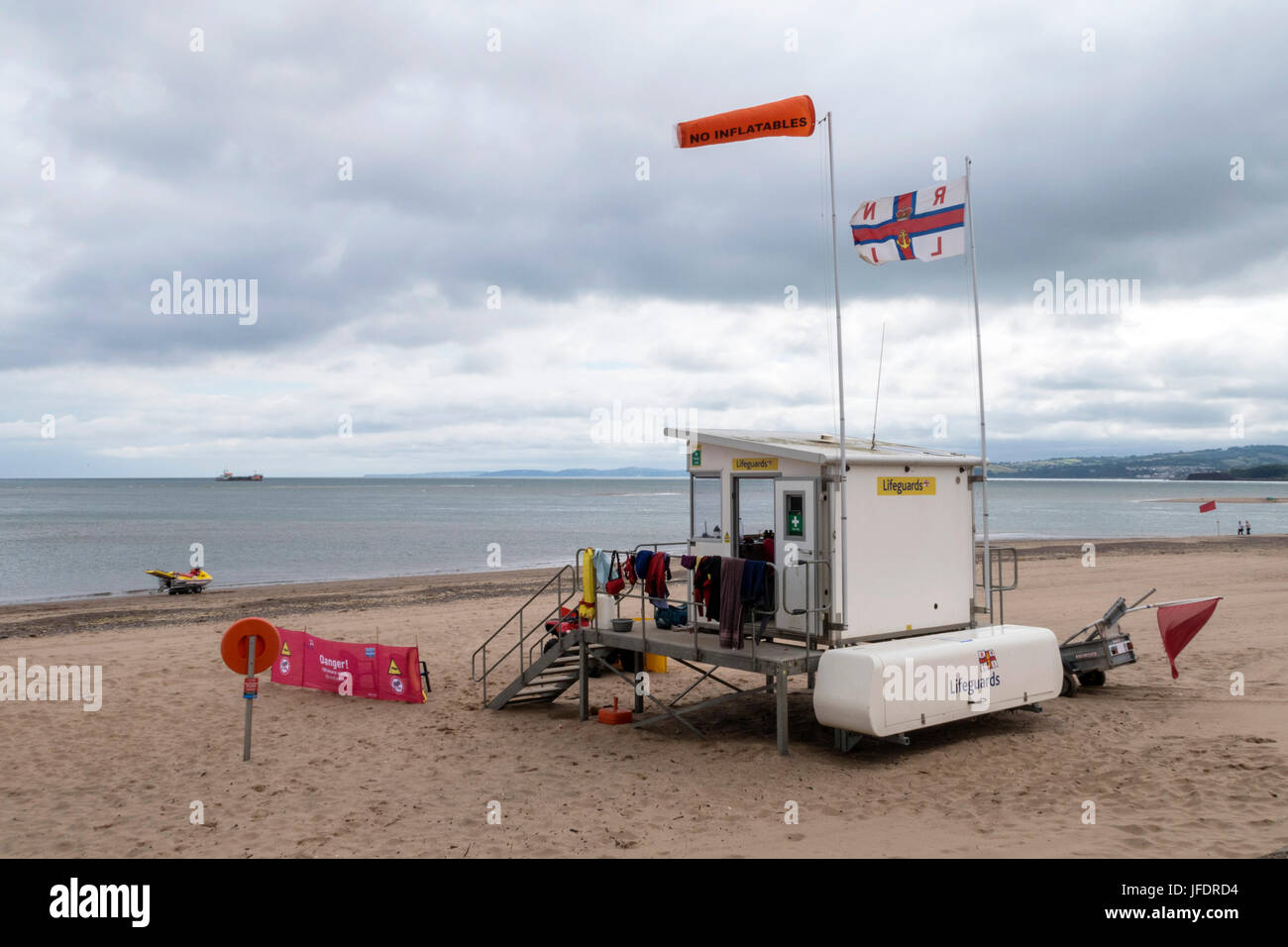 An RNLI lifeguard station on Exmouth beach, Devon, with a jet ski ready for rapid response. Stock Photo