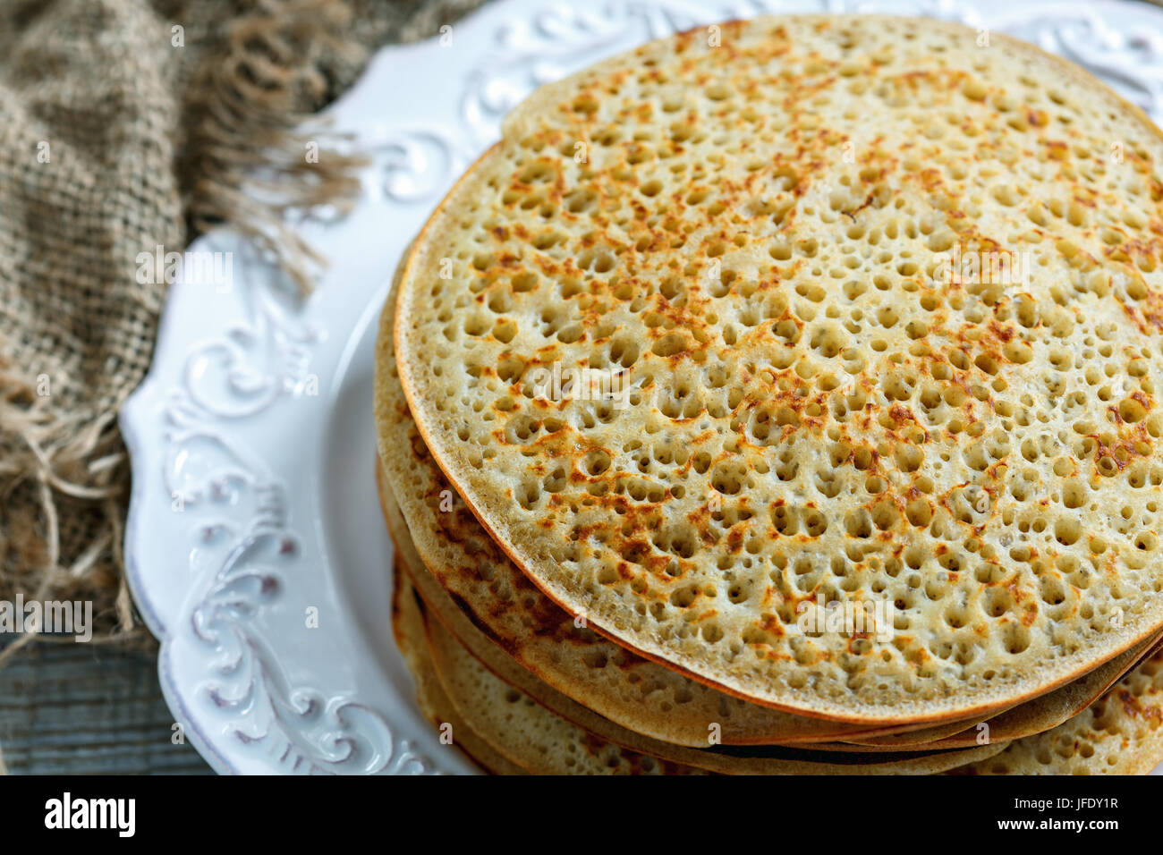 Plate with pancakes from wholemeal flour. Stock Photo