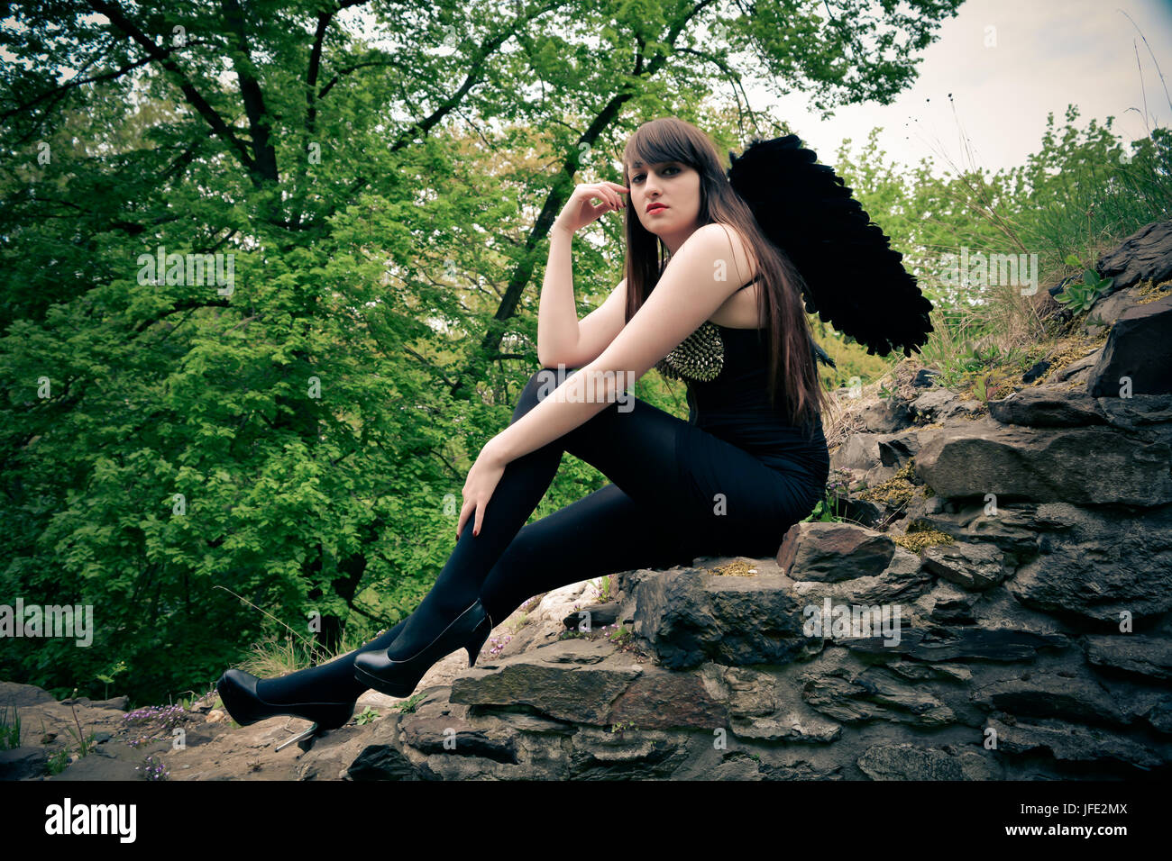 beautiful woman as a black angel Stock Photo - Alamy