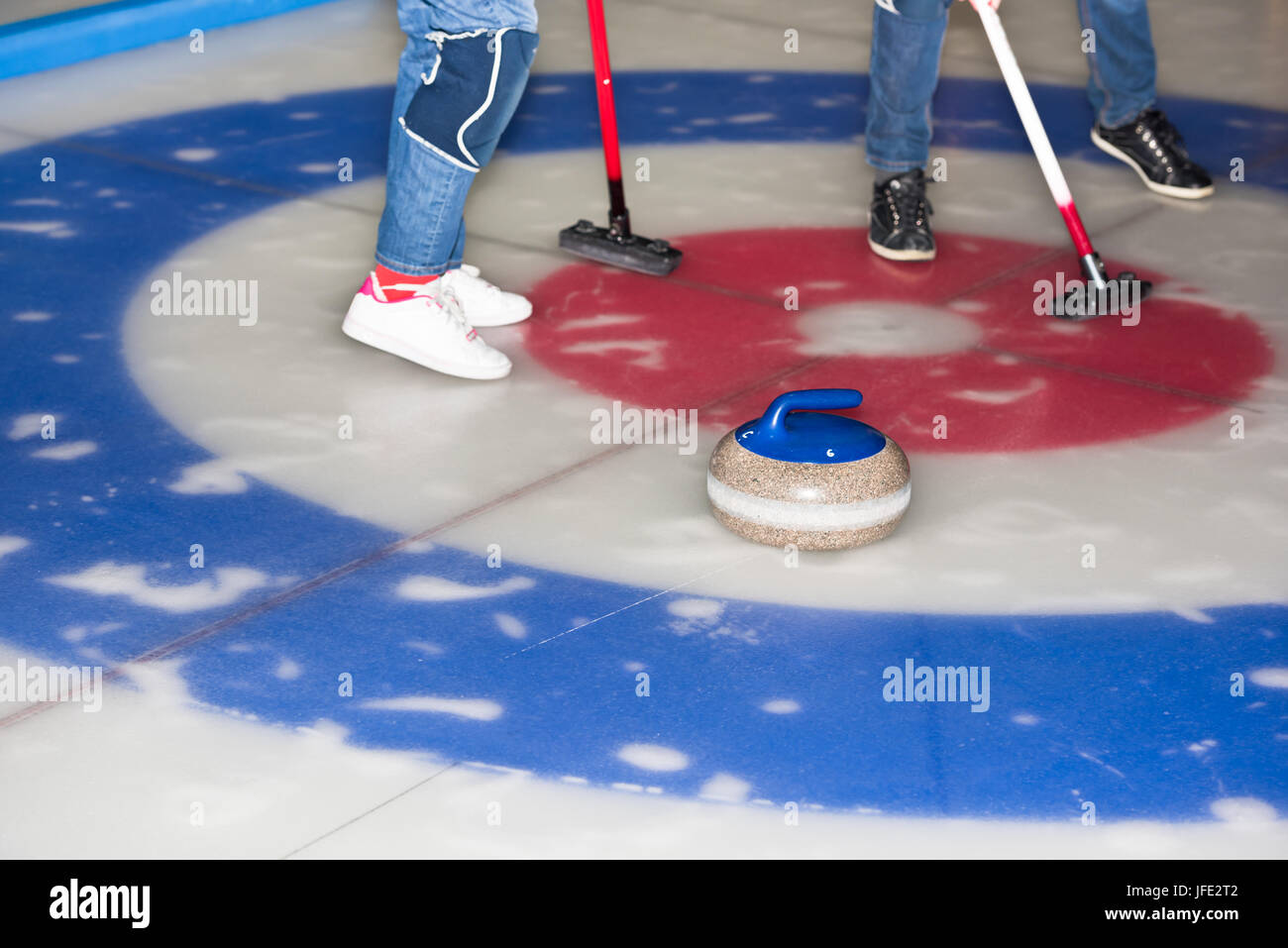 Equipment for curling sport game the ice Stock Photo Alamy