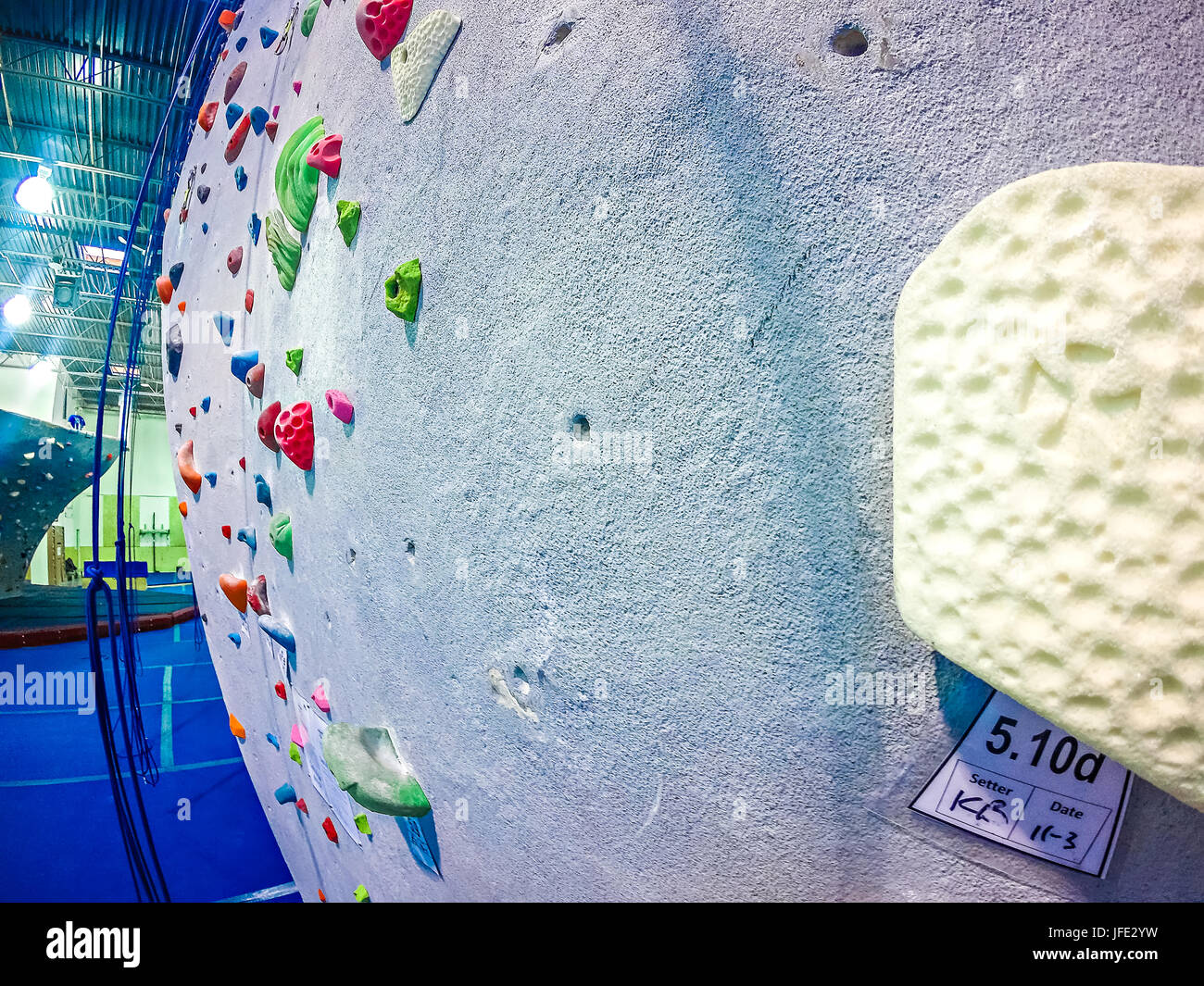 Rock climbing wall recreation center Stock Photo - Alamy