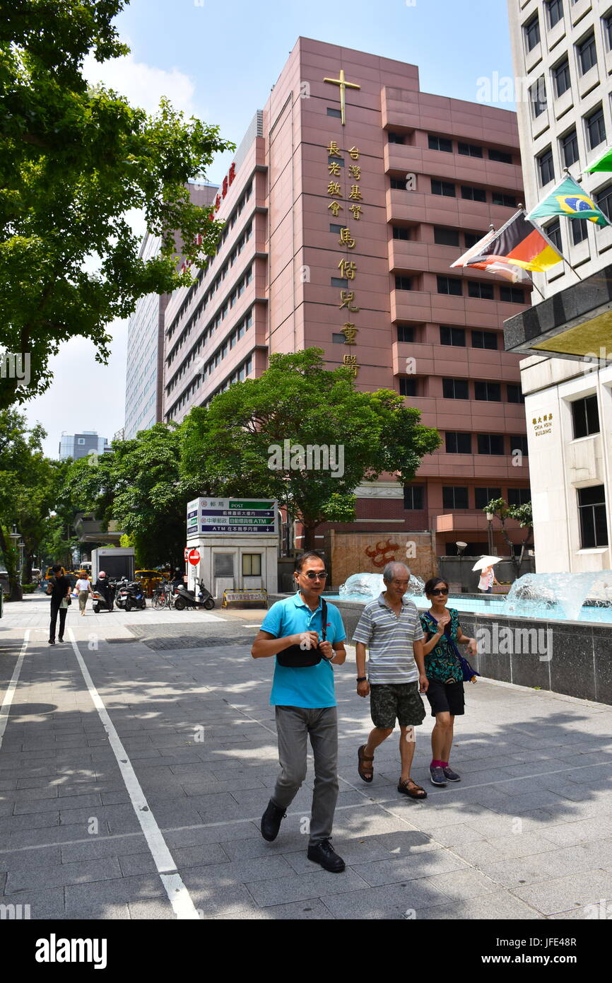 Some country flags blowing in the wind near the Mackay Hospital in Taipei , Taiwan Stock Photo