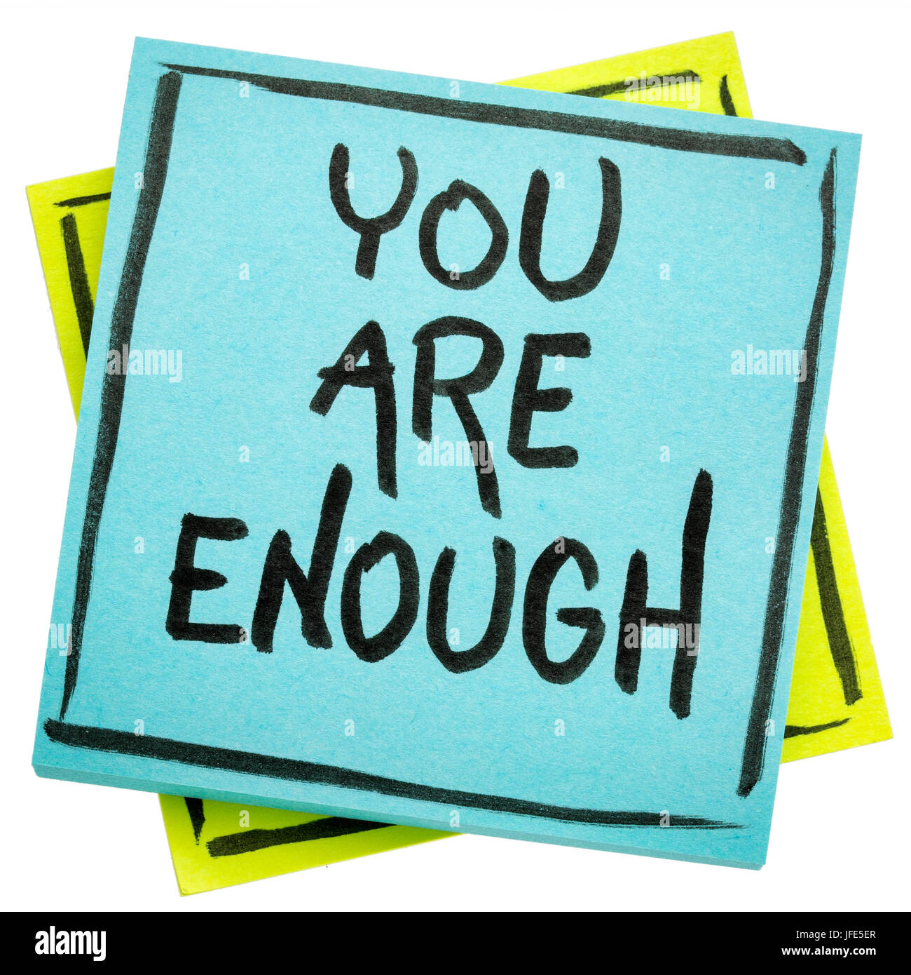 you are enough inspirational concept handwriting in black ink on an