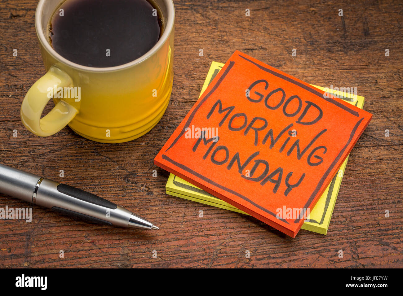 Good Morning Monday Cheerful Message On A Sticky Note With A Cup Of Coffee And Pen Stock Photo Alamy