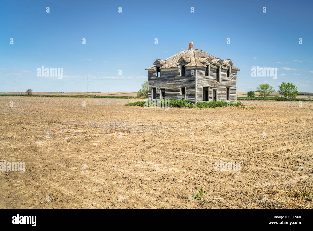 rural Nebraska landscape abandoned old house in the middle of a field