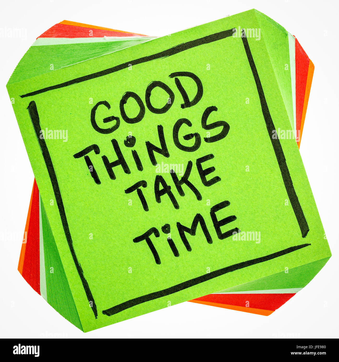 Good things take time quote  - handwriting on an isolated reminder note Stock Photo