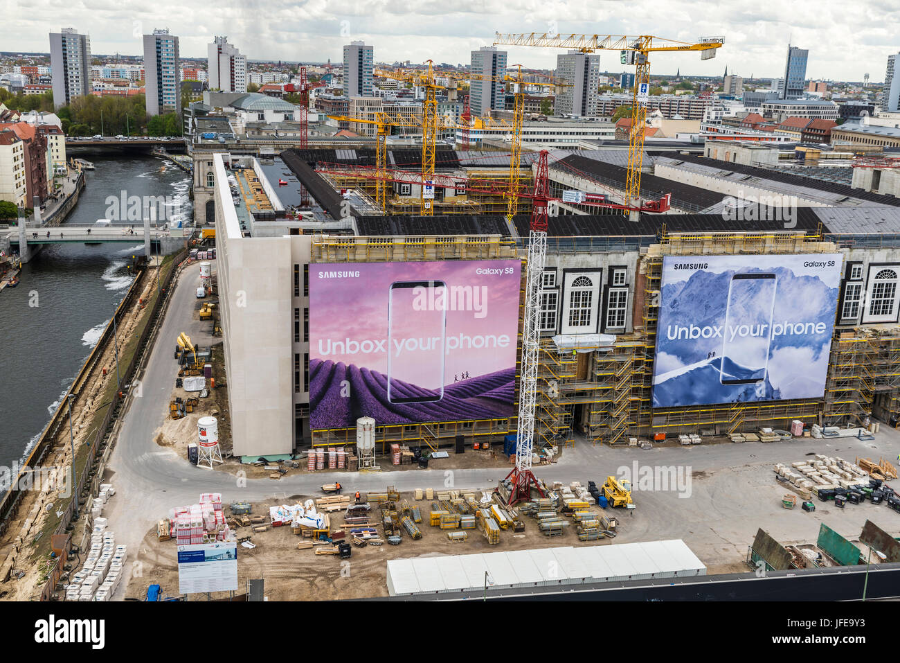 Berlin, Germany - April 13, 2017: Overview of Berlin with many construction cranes and mobile phone ads Samsung Galaxy S8 in Berlin, Germany Stock Photo