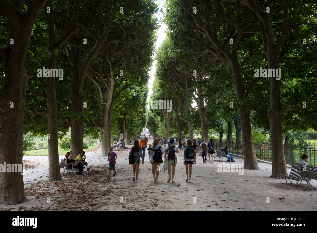 People walk along the path in the botanical garden of the Jardin des Plantes. Stock Photo