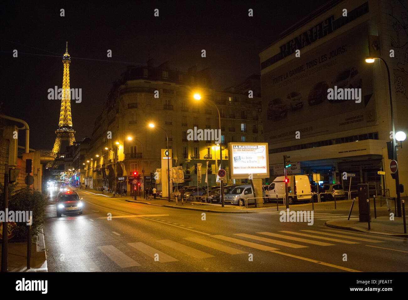 The Eiffel Tower and Paris streets at night. Stock Photo