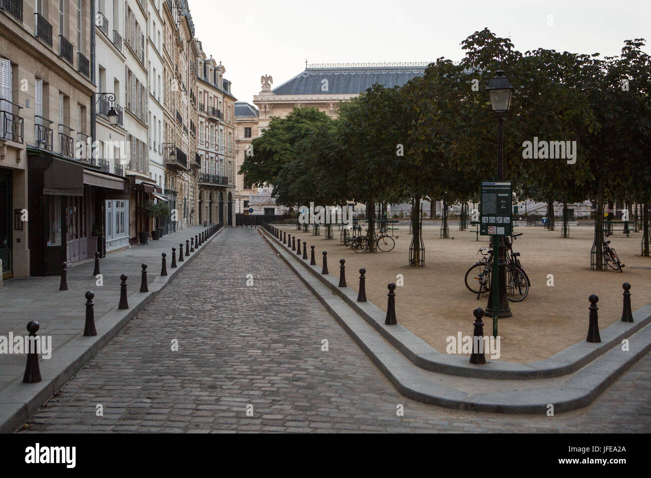 Narrow streets and the park at Place Dauphine, on Ile de la Cite. Stock Photo