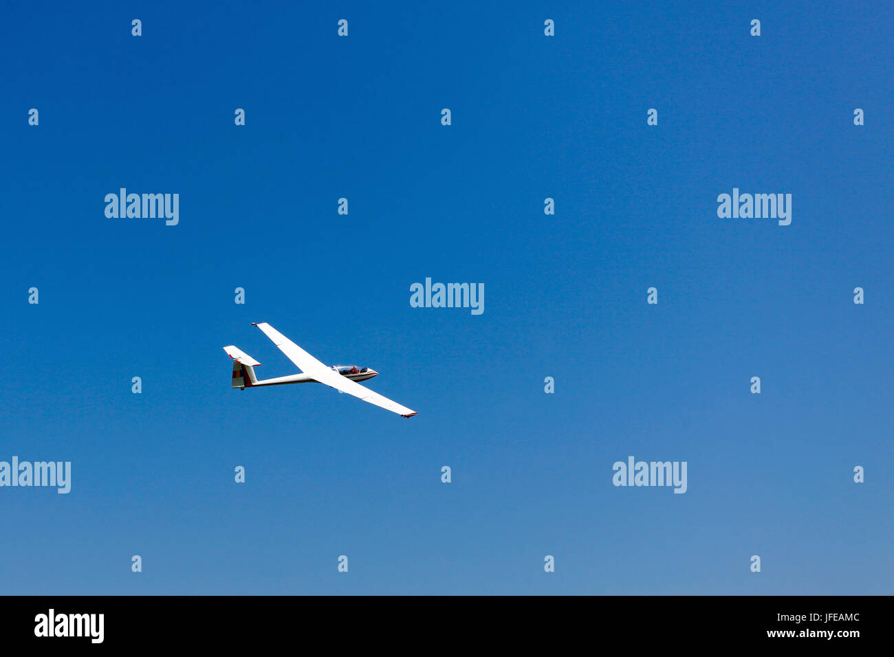 Glider flying on a blue sky Stock Photo Alamy