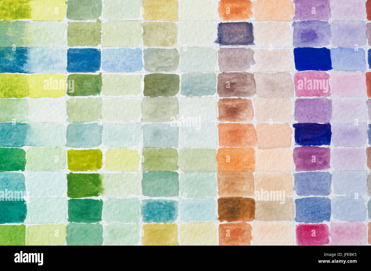 A filled grid of watercolour paint shades comparing full strength of colour to it's diluted equivalent in adjacent columns. Stock Photo