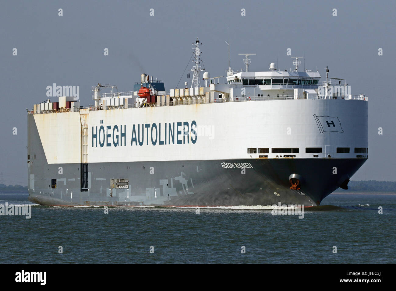 The car carrier Hoegh Xiamen passes Terneuzen and continues to the port of Antwerp. Stock Photo