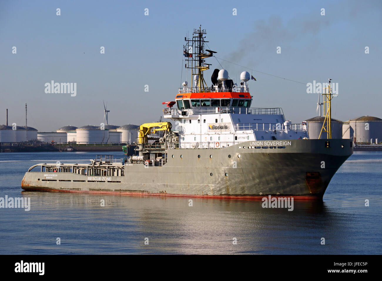 The tugboat Union Sovereign is waiting in the port of Rotterdam to haul the Thiaf out of the port. Stock Photo