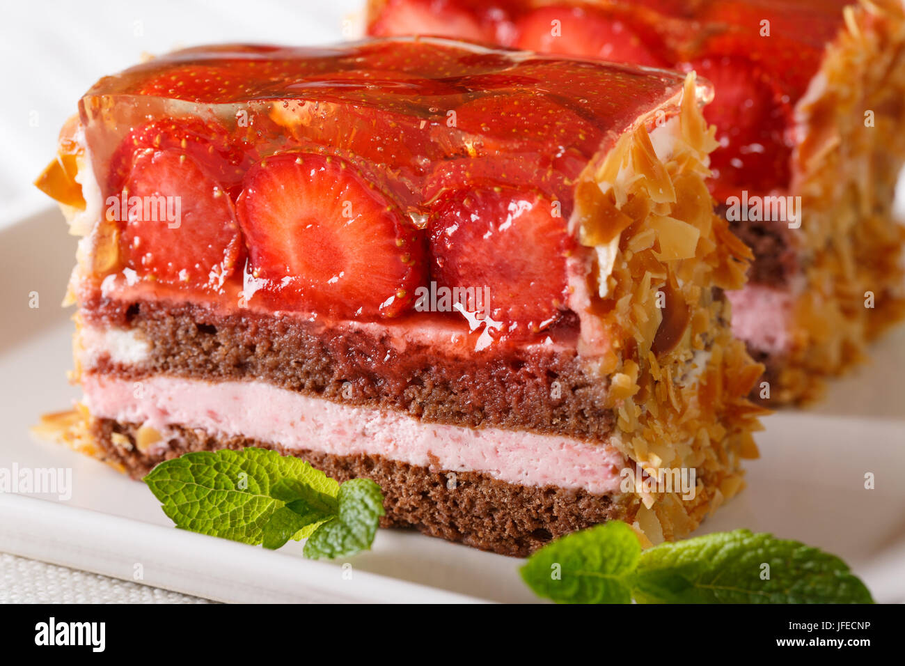 freshly cooked strawberry chocolate cake with jelly macro on a plate on ...
