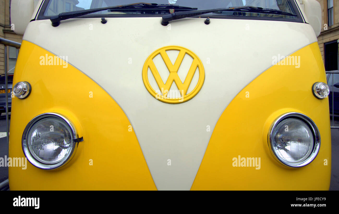 detail of Volkswagen caravan van truck classic badge bonnet front yellow Stock Photo