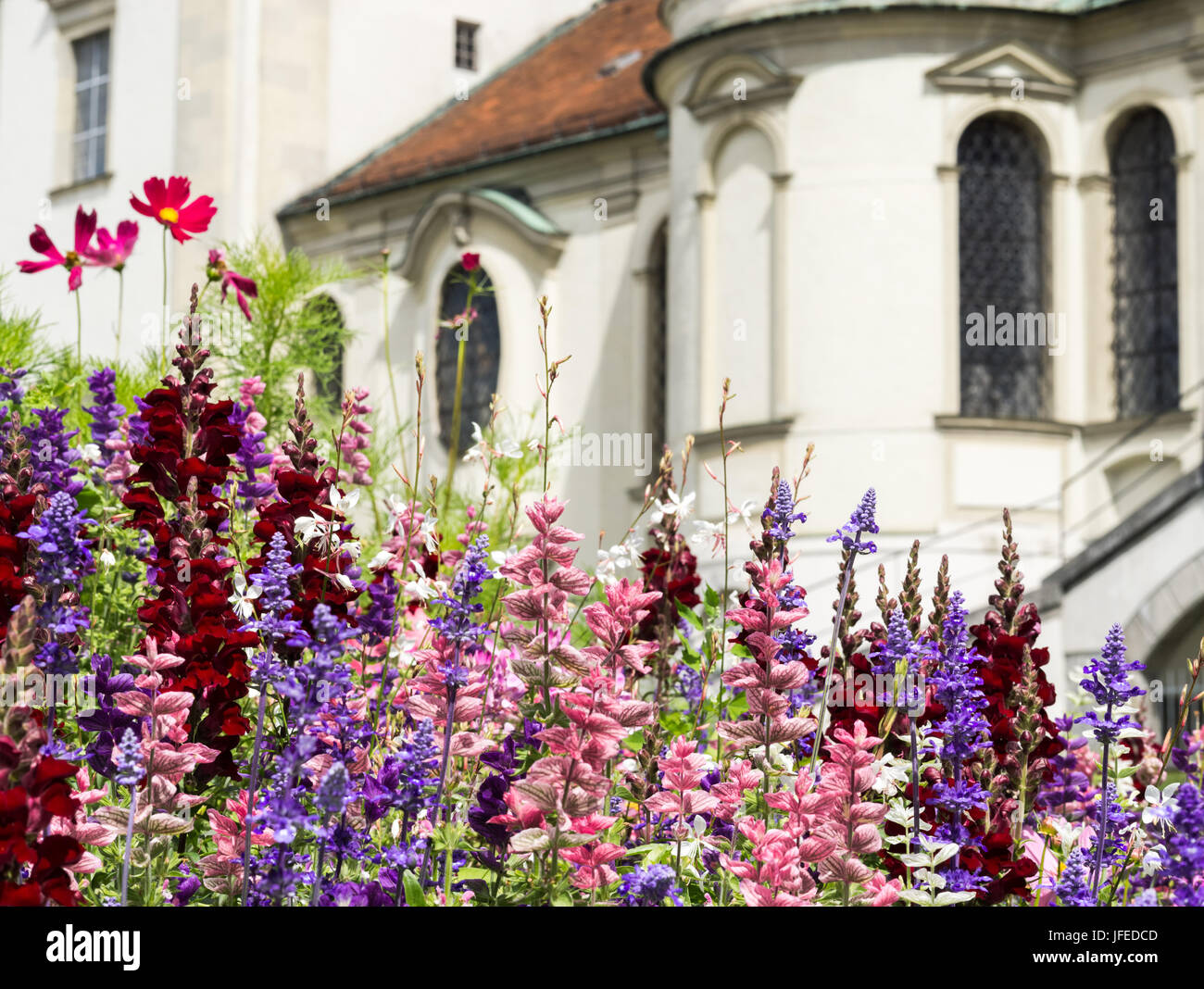 Greeting Card with colorful flower and church. Beautiful summer flowers. Stock Photo