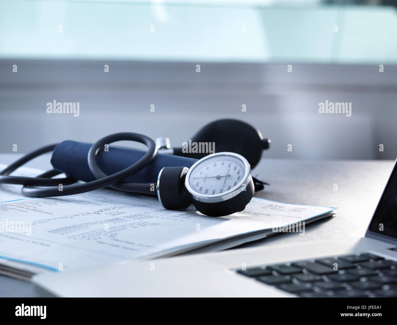 Blood pressure gauge sitting on a doctors desk Stock Photo Alamy