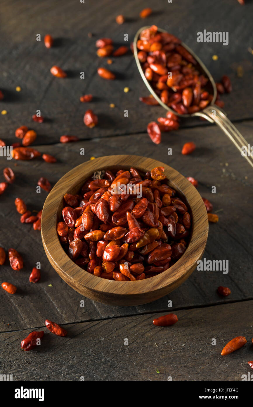 Organic Dry Small Pequin Chili Peppers in a Bowl Stock Photo