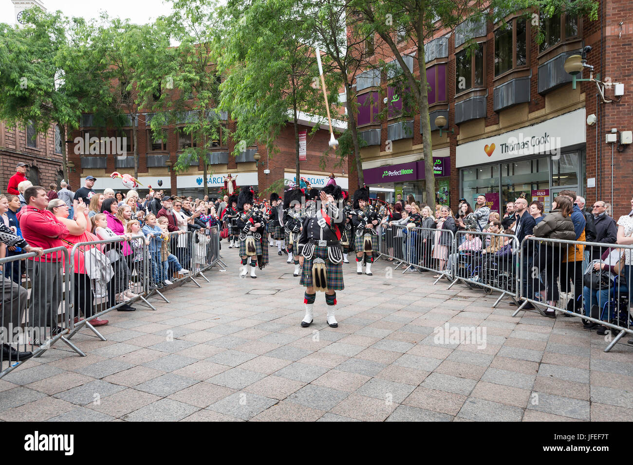 Close up of a piper in the Warrington Pipe Band marching through the town centre on Warrington Walking Day Stock Photo