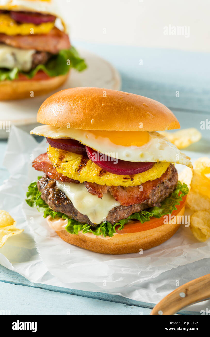 Homemade Aussie Pineapple and Beet Cheeseburger with Egg and Bacon Stock Photo