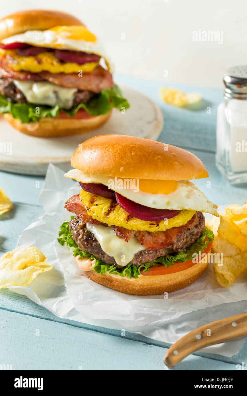 Homemade Aussie Pineapple and Beet Cheeseburger with Egg and Bacon Stock Photo