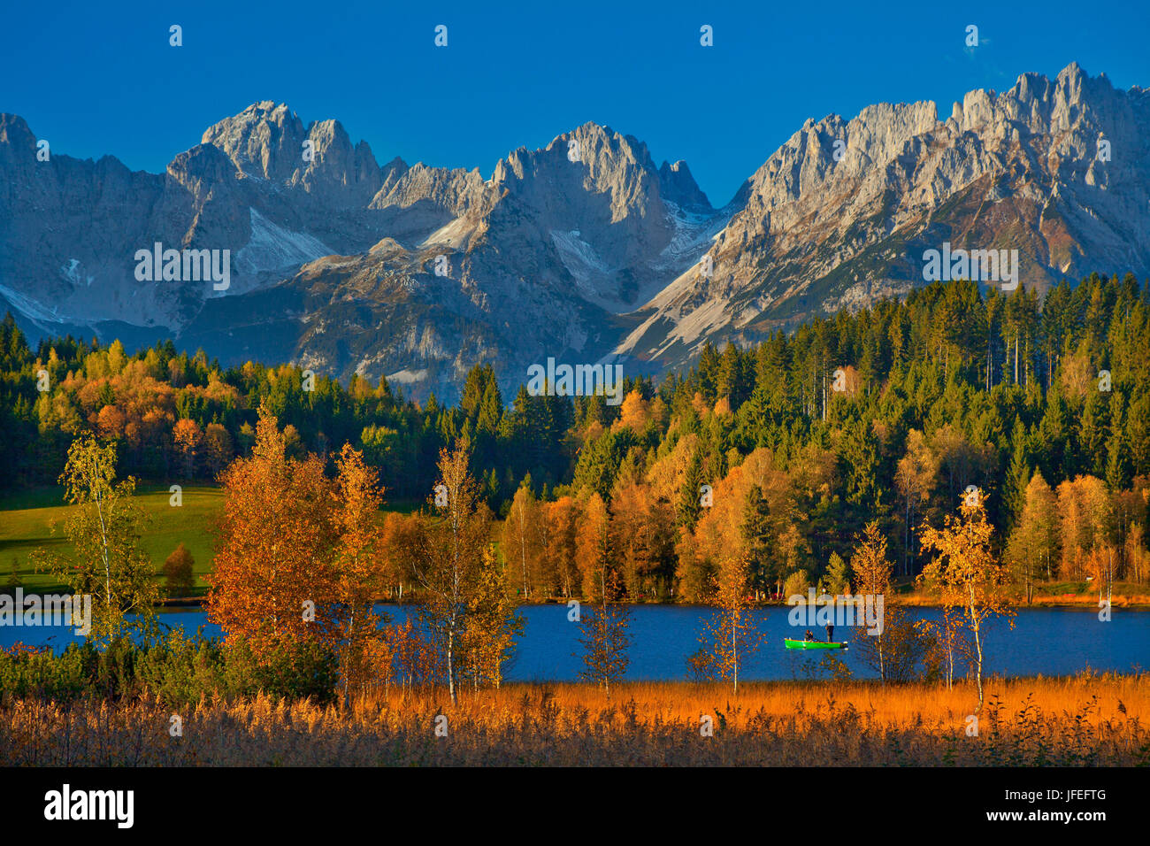 Austria, Tyrol, Kitzbuehel, black lake against wild emperor, autumn, Stock Photo