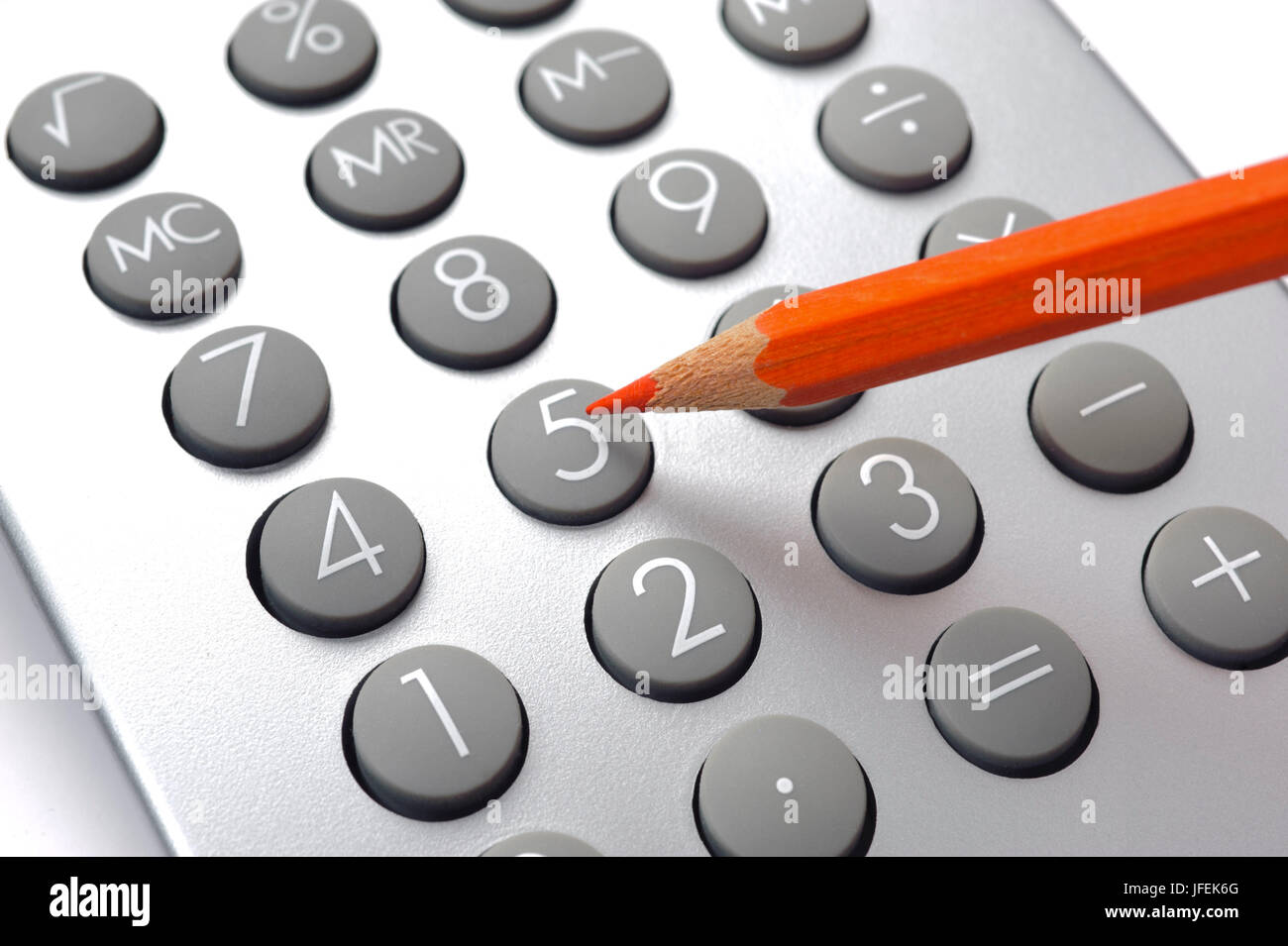 Red pen on electronic calculator Stock Photo